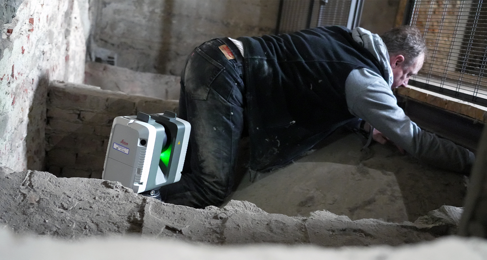 Professor George Bent scans the top of an ancient vault in the rafters of the Basilica di San Lorenzo. 